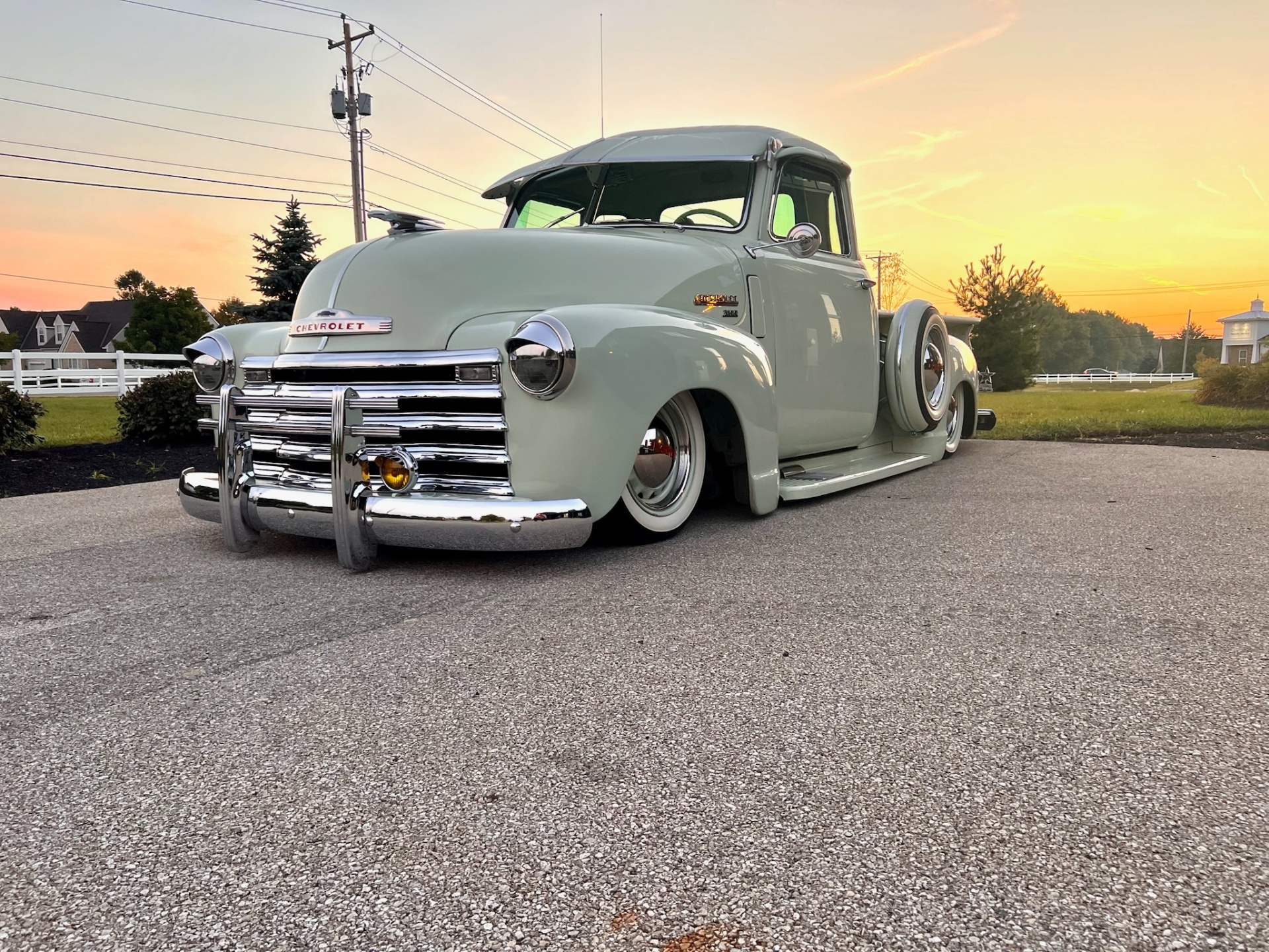 Slammed Chevrolet 3100 at sunset