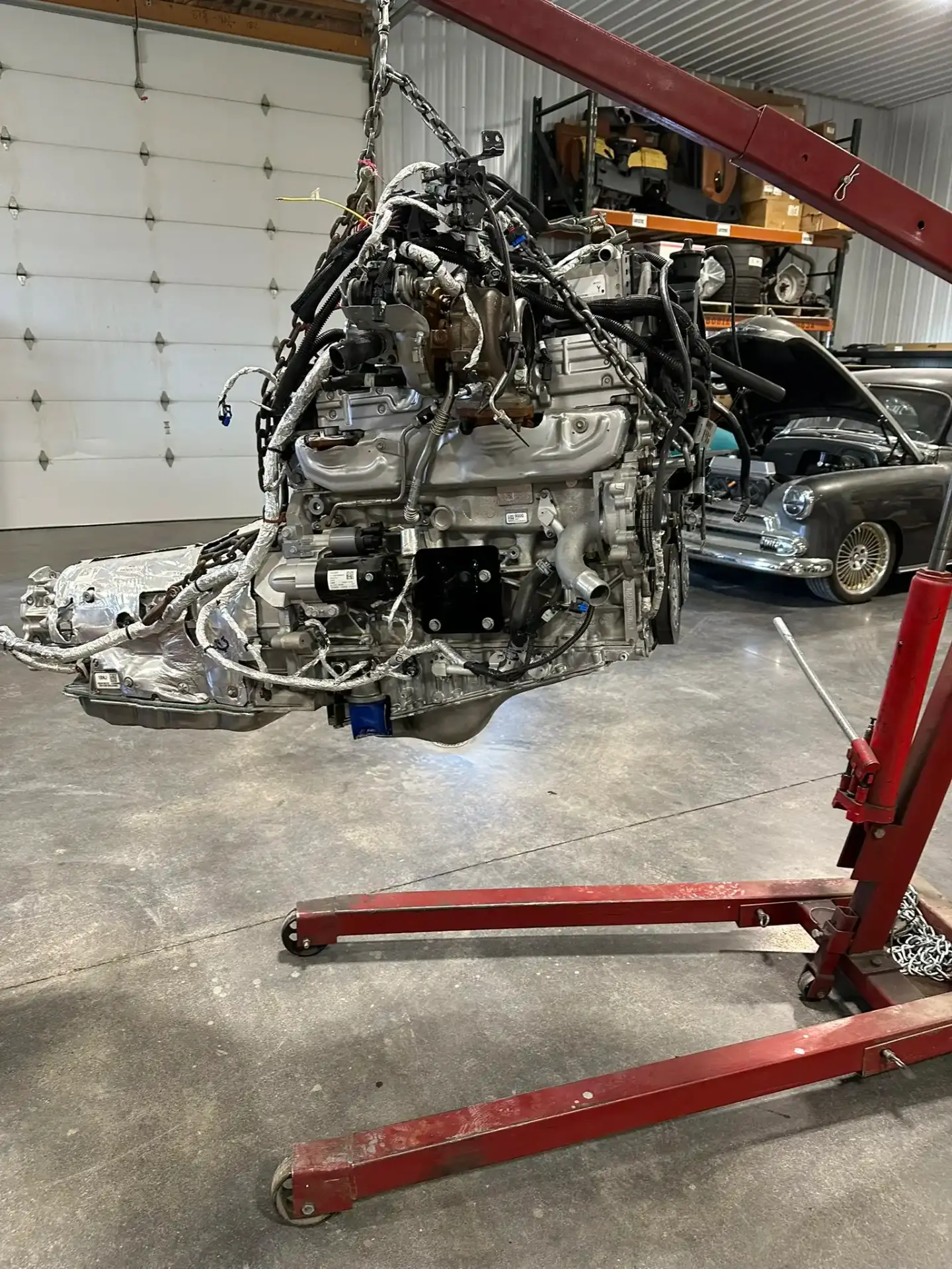 Engine and transmission on hoist ready for install