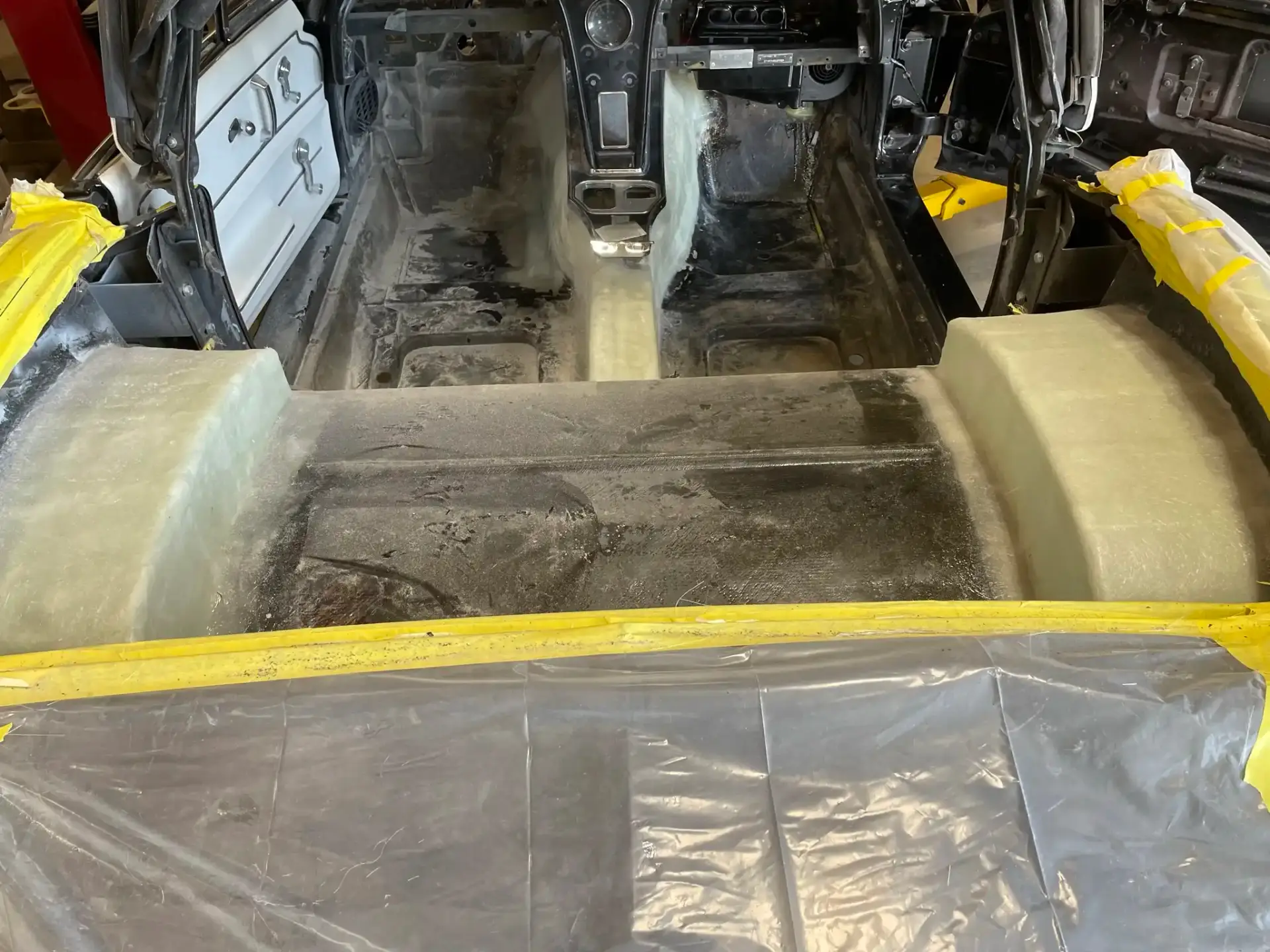 Rear interior stripped with foam insulation for body prep
