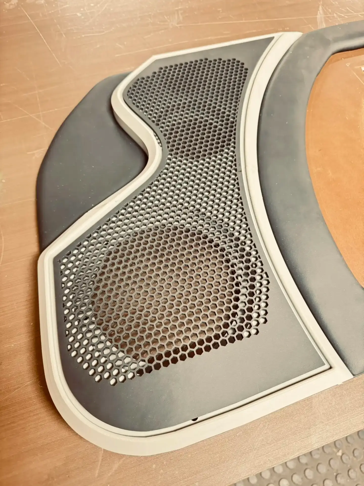 Custom door panel with honeycomb speaker grille
